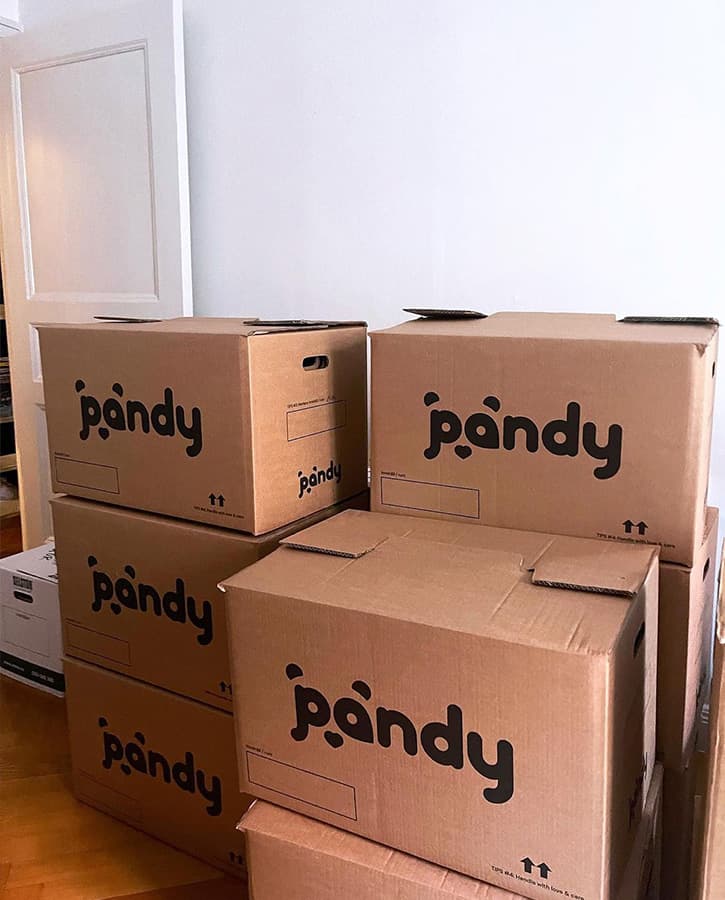 Pandy's moving boxes packed and stacked on top of each other