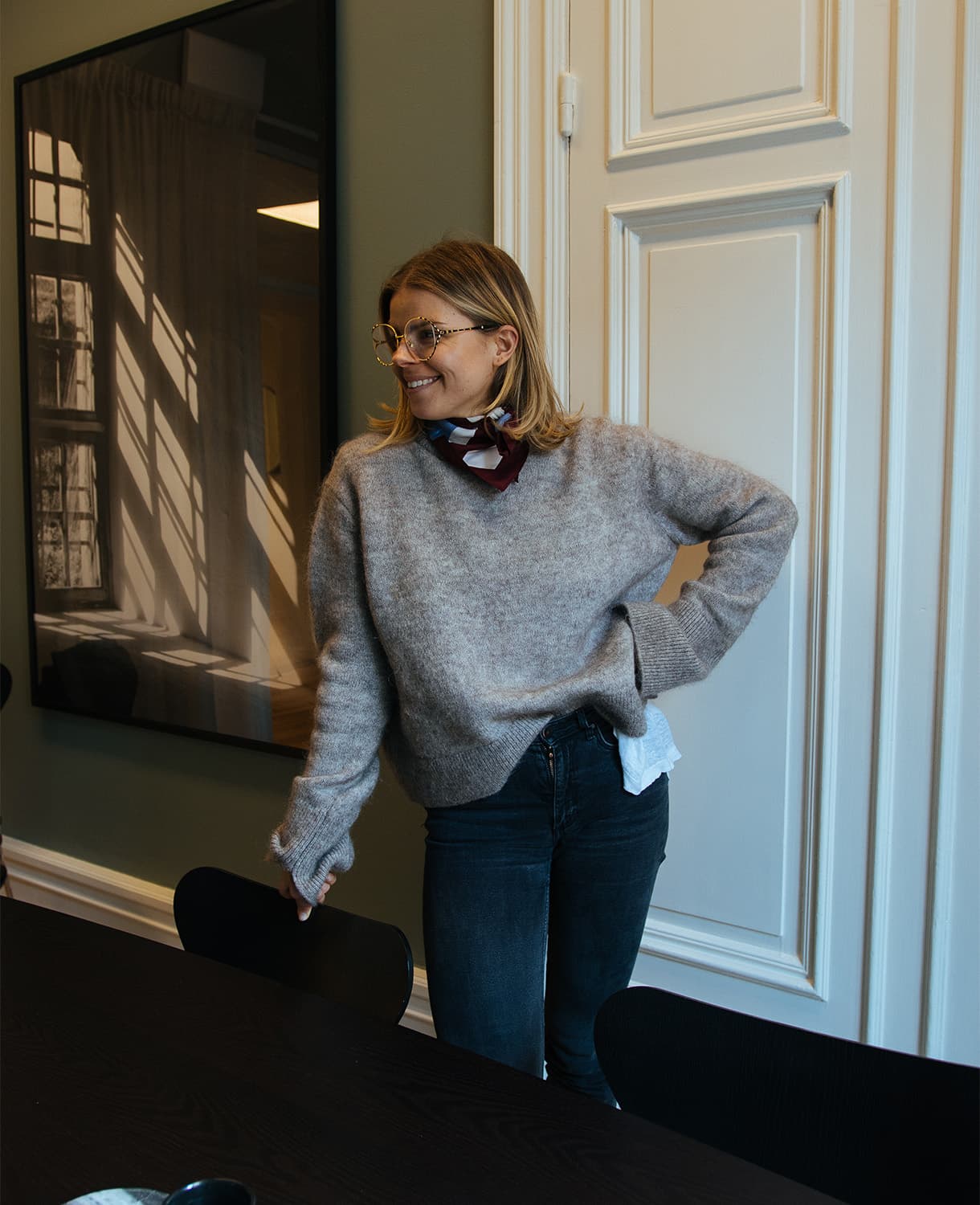 Young woman with a big smile at the Redgert Comms office