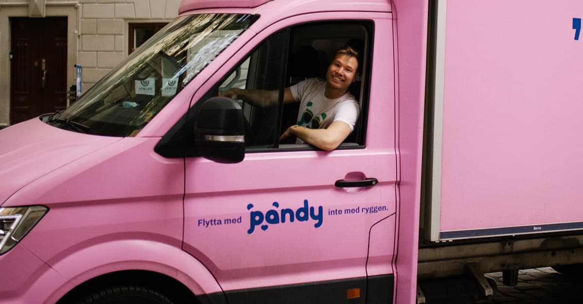 Pandy's pink moving van with the driver in the cab
