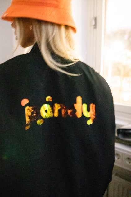 Woman in a trendy Pandy jacket with her back to the camera
